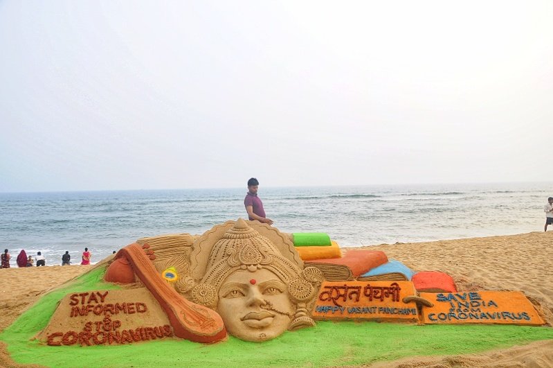 Sand Art of Goddess Saraswati on the golden sea beach of Puri
